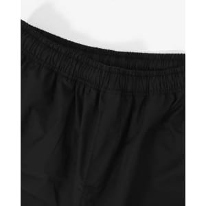 Black unisex shorts with an elastic waistband, featuring a smooth texture and minimal detailing.