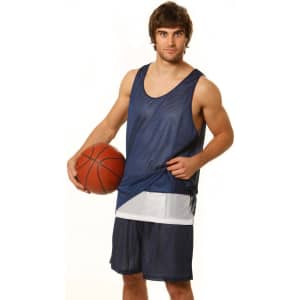 A man in navy blue basketball shorts and a matching jersey holds a basketball, featuring a logo on the jersey.