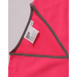 A pink safety vest with grey trim and a label attached at the neckline.