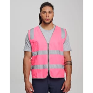 A pink hi-vis safety zip vest with reflective stripes and utility pockets, worn by a model.
