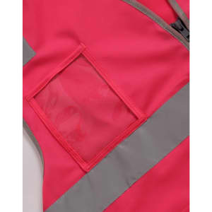 A pink hi-vis safety vest featuring reflective strips and a clear ID pocket.