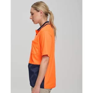 A high-visibility short-sleeve safety polo in bright orange and navy, featuring a pocket and logo.