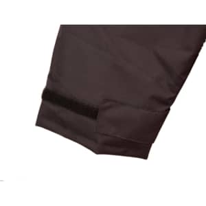 A close-up of a dark-coloured quilted safety jacket featuring a velcro strap on the sleeve.