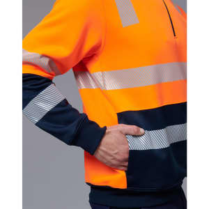 An orange and navy work jumper featuring reflective stripes and a front pocket. Includes a partial zip at the collar.