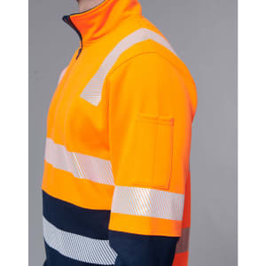 Hi-vis orange work jumper featuring reflective stripes and a navy blue bottom section. Includes a logo on the sleeve.