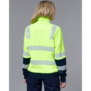 A high-visibility yellow jumper with reflective stripes, featuring a dark blue sleeve section and a high collar.