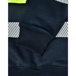 A close-up of a navy work jumper featuring reflective stripes and a high-visibility yellow neckline, with ribbed cuffs.