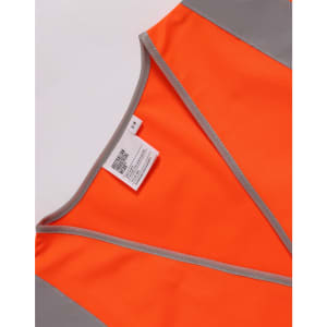 An orange safety vest featuring grey shoulder reflective tapes and a tag inside.