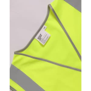A bright yellow safety vest featuring reflective shoulder tapes and a label.