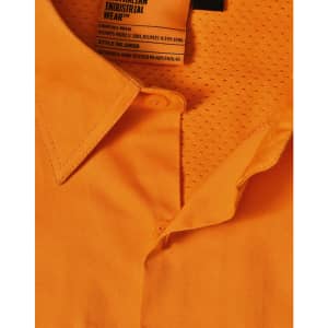 An orange safety shirt featuring a collar and mesh detailing, with a tag indicating industrial wear.