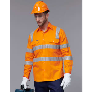 A safety shirt in bright orange with reflective stripes, worn by a model donning protective gear and gloves.