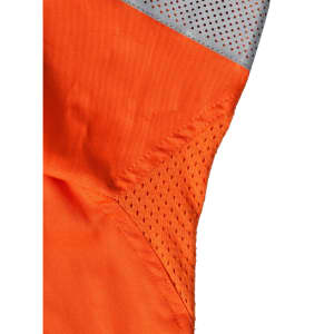 An orange work shirt featuring grey mesh panels, designed for safety in a work environment.