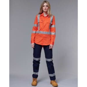 A high-visibility orange work shirt with reflective stripes, paired with dark navy pants and work boots.