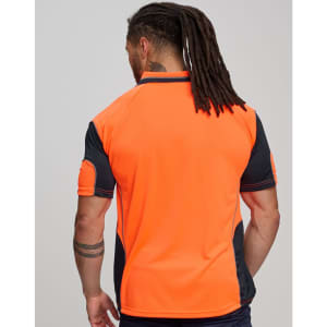 A hi-vis polo shirt in bright orange with black accents and a branding logo on the back.