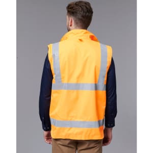 A reversible safety vest in bright orange with reflective stripes, viewed from the back. It has a logo on the fabric.