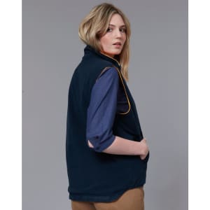 A reversible safety vest in navy with orange piping, featuring a high collar and arm openings. It has a logo.