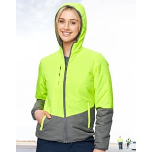 A woman wearing a Hi-Vis quilted two-tone safety jacket in fluorescent yellow and grey, featuring a hood and zipped pockets.
