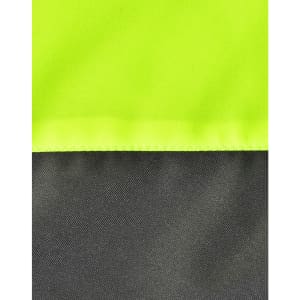 A close-up of a hi-vis quilted safety jacket featuring fluorescent yellow and dark grey sections, plus visible stitching.