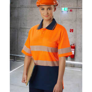 A safety polo shirt in high-visibility orange with reflective stripes and a navy blue lower section, worn by a model.