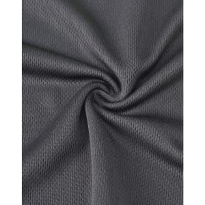 A textured, dark grey fabric showcasing the breathable mesh of a unisex polo shirt designed for workwear.