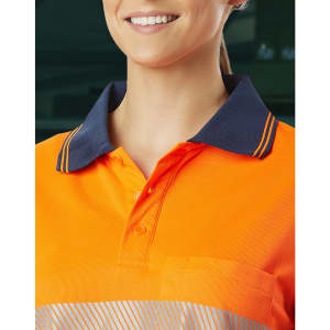 Unisex Cooldry segmented safety long sleeve polo in bright orange with navy collar and a pocket. Features a logo.