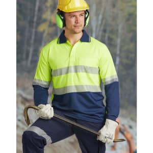 A bright yellow and navy long-sleeve safety polo shirt with reflective stripes, worn by a worker in safety gear.