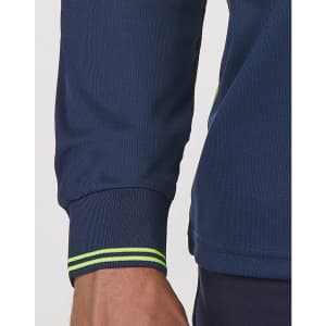 A close-up of a navy unisex polo shirt featuring segmented long sleeves and contrast stitching in green.