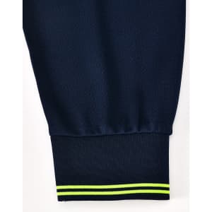 A navy blue long-sleeve polo shirt featuring a ribbed cuff with yellow and green stripes, and a logo.