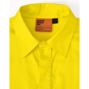 A bright yellow long-sleeve work shirt with perforated tape and a collar. The shirt features a tag and branding.