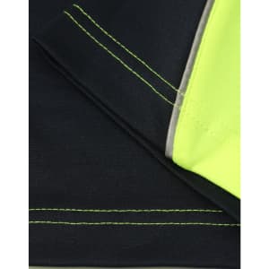 A close-up of a black and hi-vis yellow long-sleeve polo shirt, featuring contrast stitching and neckline.
