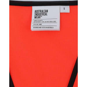 A vibrant orange safety vest with black trim and a tag indicating size and brand details, featuring a logo.