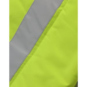 A close-up of a bright yellow fabric with a grey reflective stripe, part of a hi-vis hooded puffer vest.