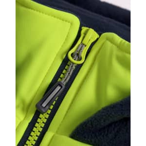 A close-up of a bright yellow zipper on a hooded puffer vest with a navy fleece lining. It has a branding logo.