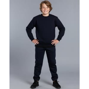 A kids' crew neck fleecy sweater in navy, worn with matching navy pants, featuring a logo on the garment.