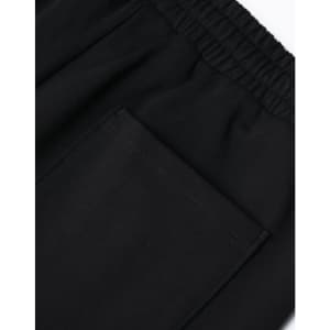 Black unisex sweatpants with an elastic waistband and a patch pocket on the side. Features a logo.