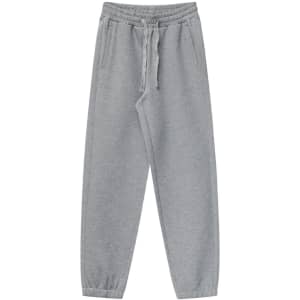 Grey unisex sweatpants with a drawstring waist and pockets, featuring a logo.