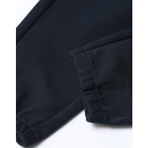 Unisex airlayered CVC sweatpants in navy, featuring a cuffed hem and soft fabric texture. Complete with a logo.