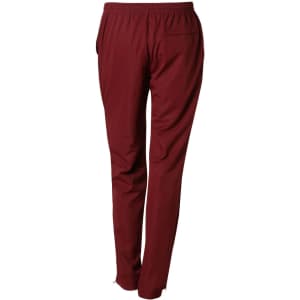 Maroon kid's track pants with an elastic waistband and pockets, featuring a logo on the back.