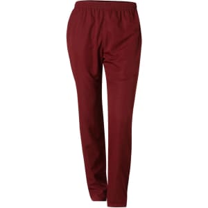 Kid's track pants in burgundy with an elastic waistband and a streamlined fit. Features a logo.