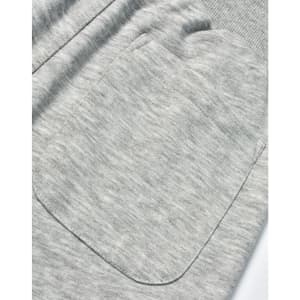 A close-up of grey poly/cotton terry fabric featuring a large pocket on sweat pants.
