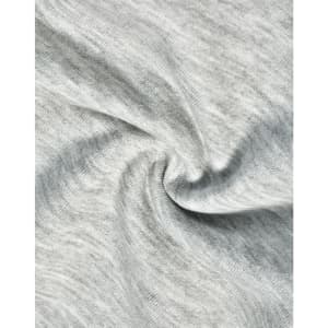 A close-up of light grey fabric, showcasing the soft texture of poly/cotton terry.