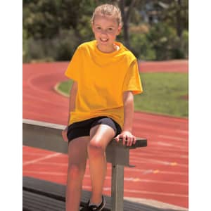A bright yellow semi-fitted cotton t-shirt on a girl sitting on a bench near a running track.