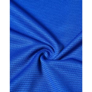 A close-up of textured blue fabric, showcasing a lightweight, performance material ideal for t-shirts.