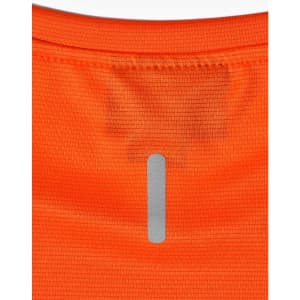 An orange lightweight performance t-shirt featuring a reflective logo on the back.