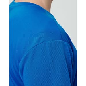 A close-up of a men's short-sleeve t-shirt in a vibrant blue colour with a textured fabric. Features a logo.