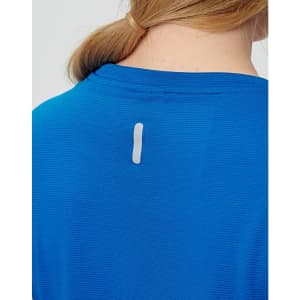 A blue ladies' short-sleeved performance T-shirt featuring a small logo on the back.