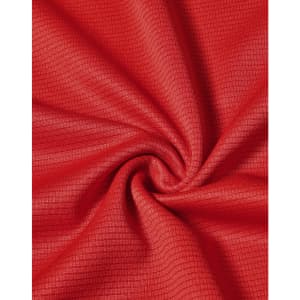 A close-up view of red fabric with a textured pattern, depicting the lightweight material of a performance t-shirt.