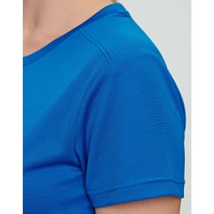 A close-up of a blue ladies' short-sleeve T-shirt, featuring a textured fabric and a logo.
