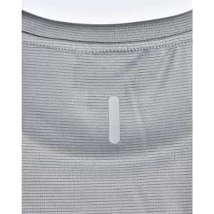 A light grey performance t-shirt featuring a textured pattern and a logo patch on the back.