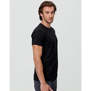 A black premium cotton men's T-shirt displayed on a model, showing a side view. The shirt features a logo.